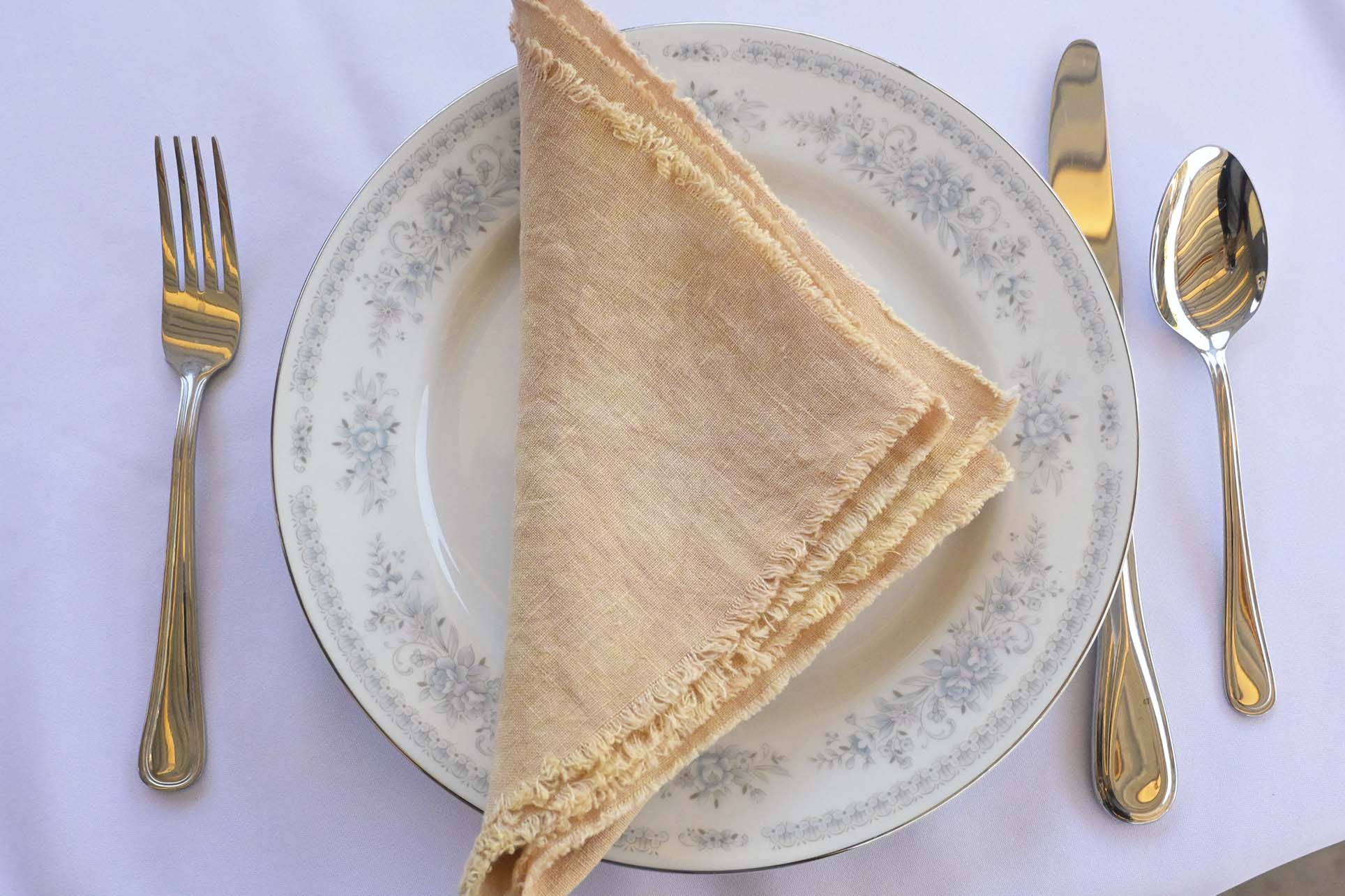 Natural linen napkins with mitered corners